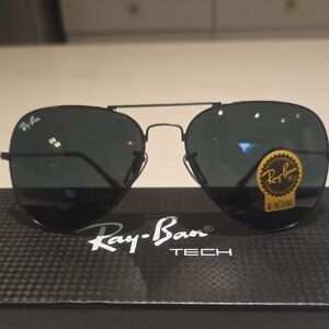 Ray-Ban Aviator Sunglasses with Dark Lenses and Black Frame